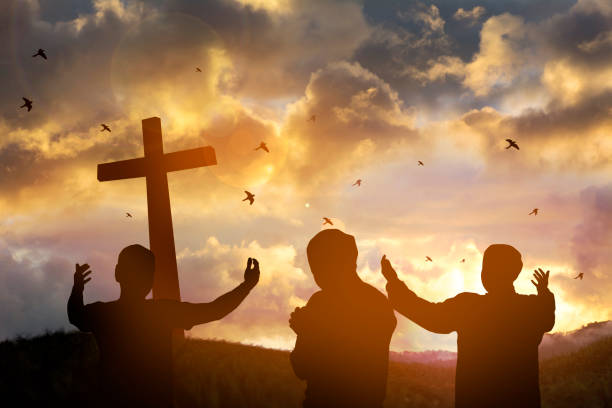istock The cross with sunset in the sky background 990033522