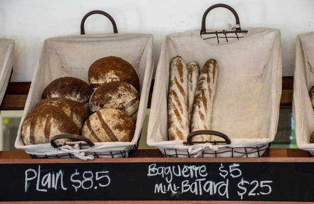 istock Freshly baked bread rolls on display outside a specialist bakery in Sydney. 990033964