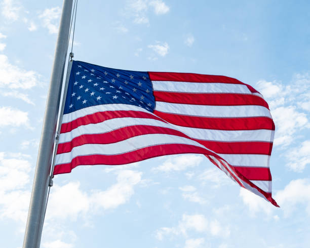 istock American Flag Blue Skies 990050846