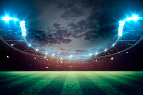 istock lights at night and football stadium 3d rendering. Mixed photos 990053186