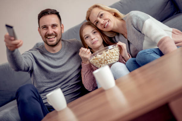 istock Cheerful young family enjoying at home 990062024