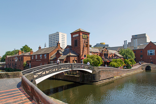 Birmingham, UK: June 29, 2018: The Malt House is a restaurant along the restored canal system in Birmingham central. It is a national heritage landmark and where the Worcester and Birmingham canals meet.