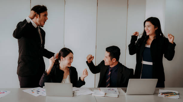 istock Business Team Success Achievement Arm Raised Concept 990082490