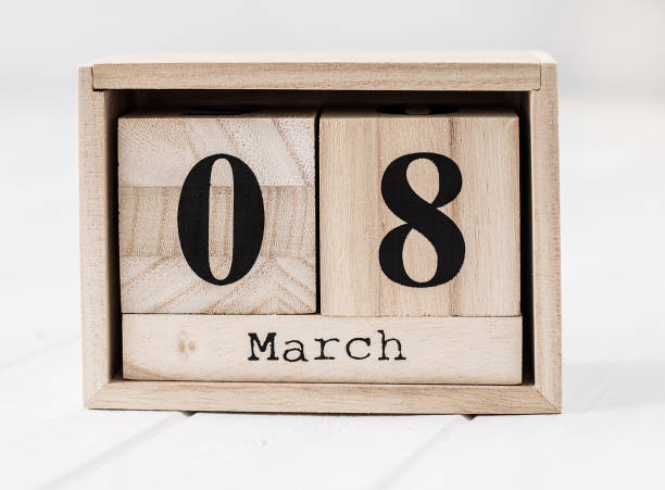 istock Wooden calendar that shows march eight 990087582