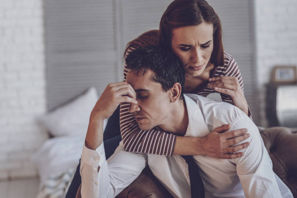 istock Pleasant beautiful woman hugging her husband 990092300