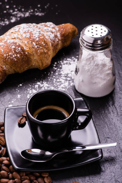 istock black cup with espresso and brioches 990096758