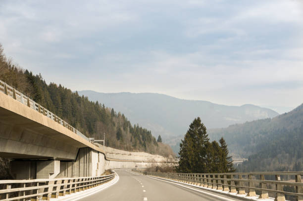 istock Deserted highway in the mountains. 990101680