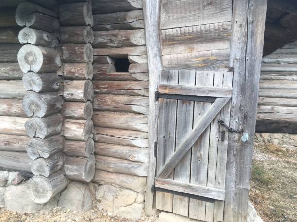 istock Old wooden wall rustic house village 990129150