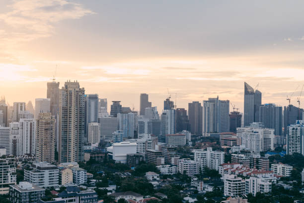 istock Bangkok cityscape after the rain in the evening with sun going down. 990154236