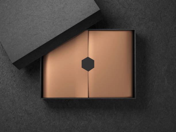 istock Black Box with Copper Gold wrapping paper and black label sticker. Horizontal 990165052