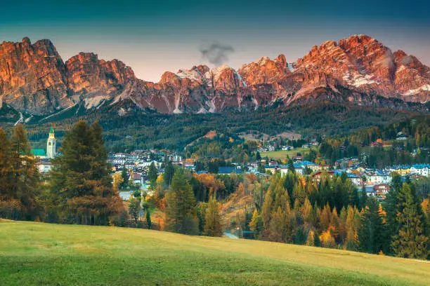 Fantastic alpine resort with stunning sunset and high mountains in background, Cortina d Ampezzo, Dolomites, South Tyrol, Italy, Europe