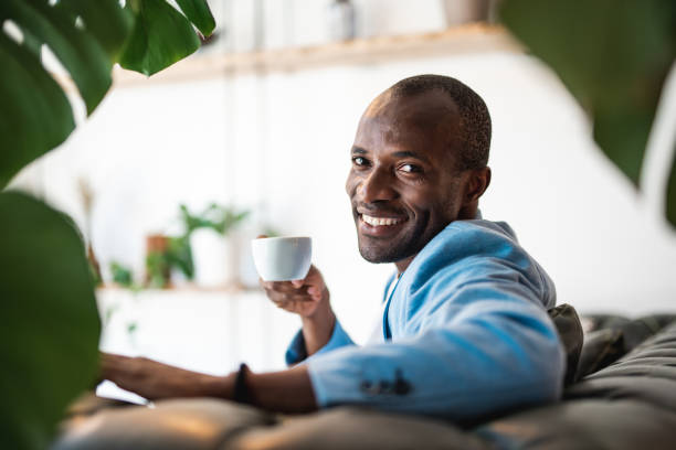 istock Outgoing man drinking mug of coffee 990208394