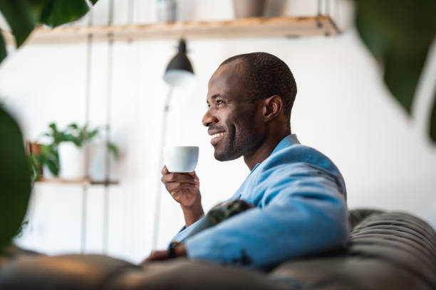 istock Positive male tasting appetizing liquid 990208428