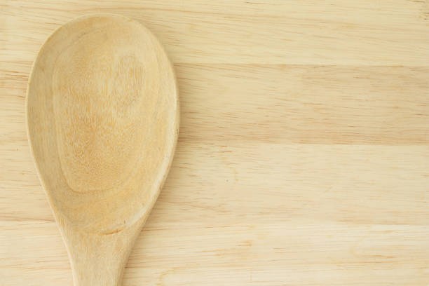istock wooden spoon on wood background 990208478