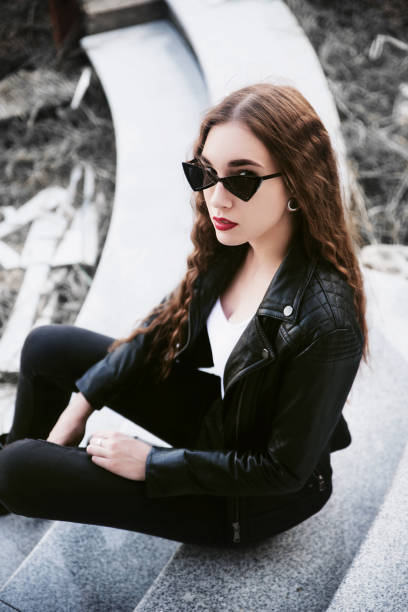 istock Young woman wearing leather jacket 990210236
