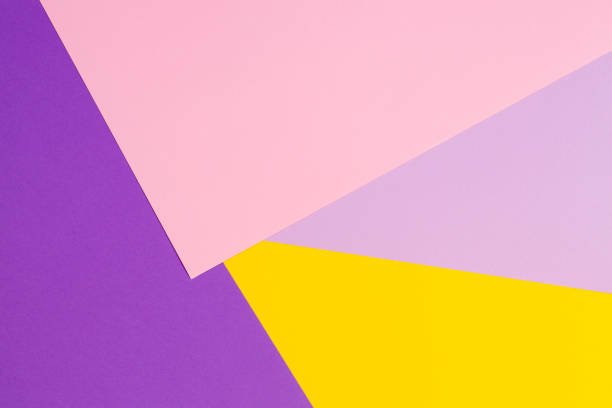 Color papers geometry flat composition background with violet, purple, pink, yellow tones.