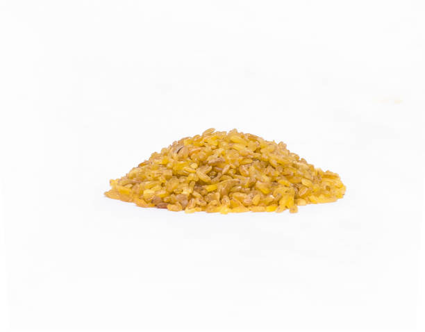 istock Heap of dry bulgur wheat isolated on white. 990225668