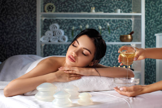 istock young woman in spa salon. 990227560