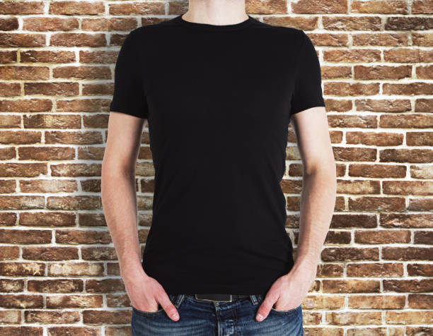 istock Man wearing black shirt on brick background 990250624