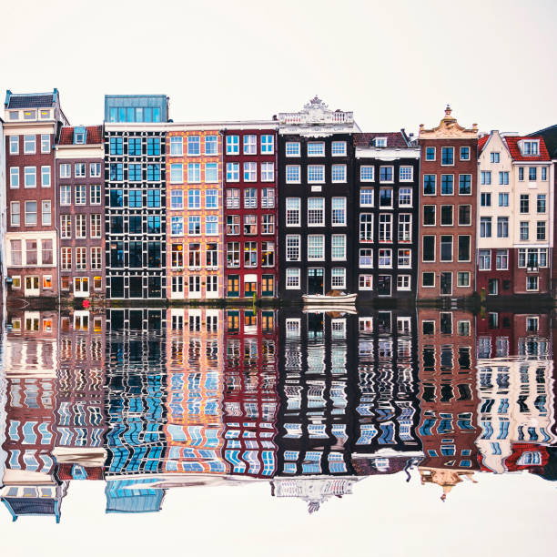 istock Typical Dutch houses built by the canal, Amsterdam, Netherlands 990258678