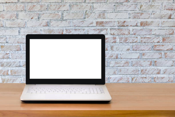 istock Mock up Laptop with blank screen on wooden table with modern interior background.Mock up business concept. 990270746
