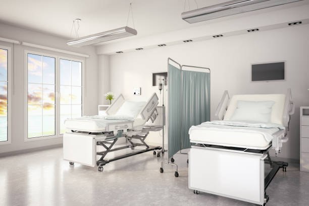 istock Adjustable Patient Beds in Hospital Room 990278504