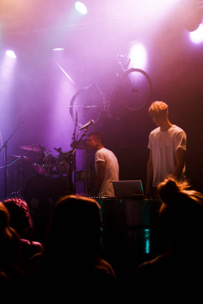 istock Yonung rock band in action on stage 990285300