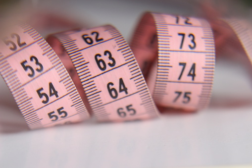 One pink sewing meter in soft focus macro