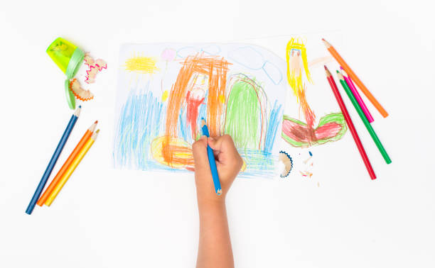 istock Drawing mermaids child four years and colored pencils. 990305886