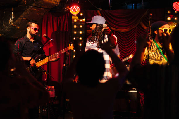 istock Rock music group singing at stage 990306154