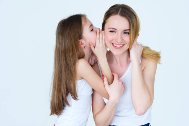 istock secret family trust relationship daughter whisper 990306994