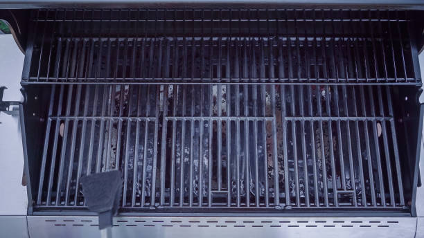 istock Cleaning outdoor gas grill. 990310898