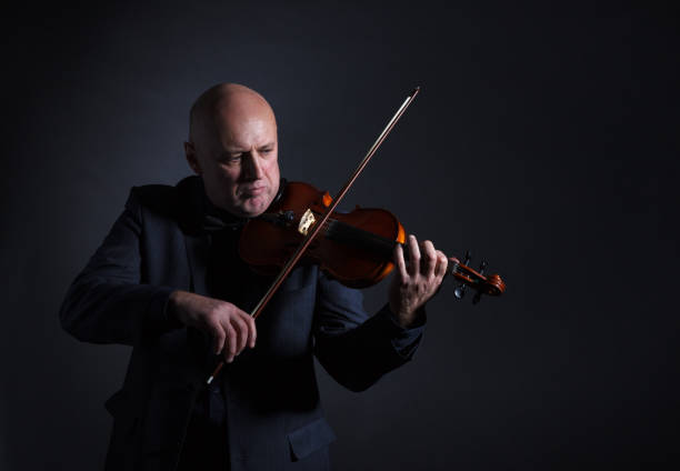 istock Older male violinist. 990319856