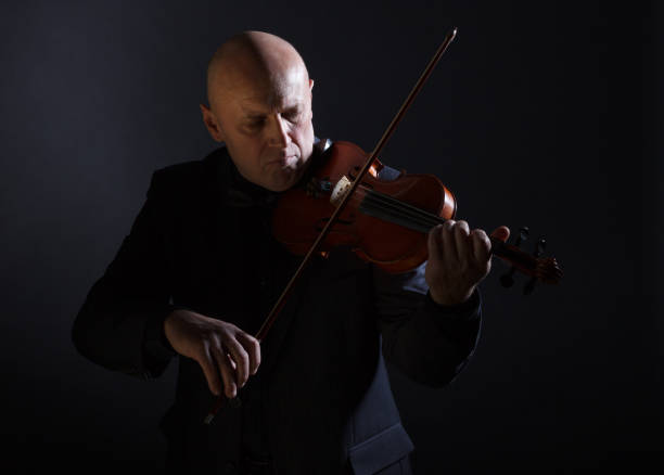 istock Older male violinist. 990320540