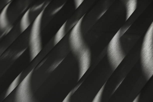 istock Light and shadow games of curtain and sun 990320664