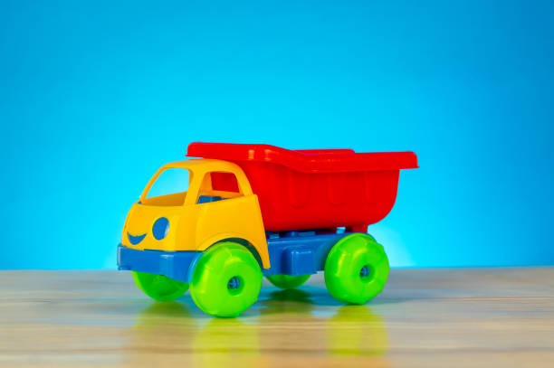 istock Colorful toy truck isolated on blue background 990326112