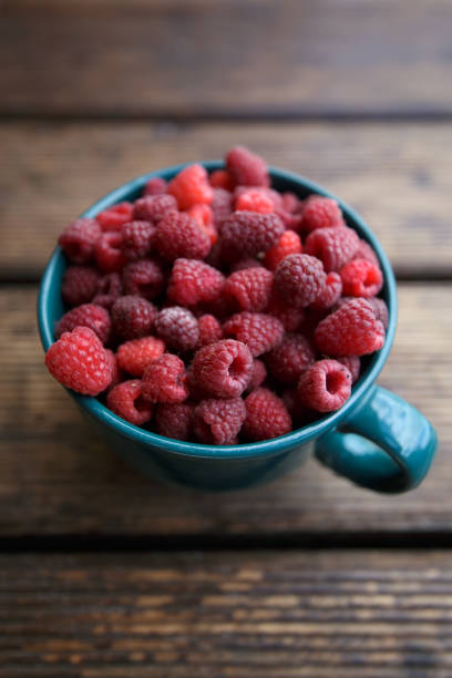 Bowl of raspberries freshly picked from home garden