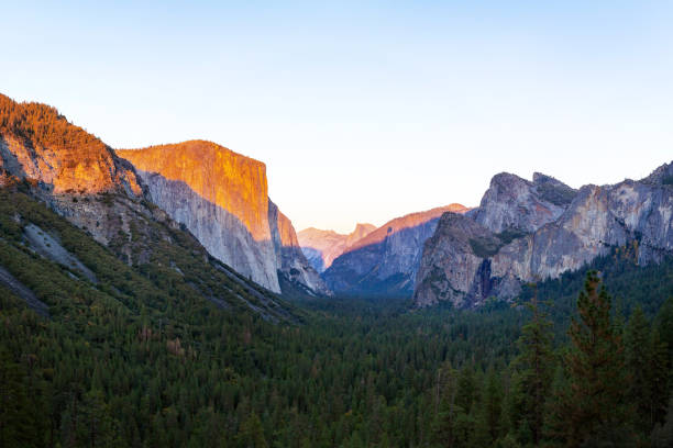 istock Yosemite valley nation park during sunset view from tunnel view on twilight time. 990337066