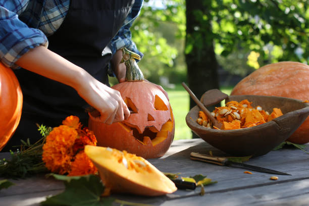 istock carve pumpkins for Halloween 990347026