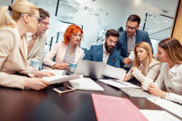 istock Positive business team working in office 990347622