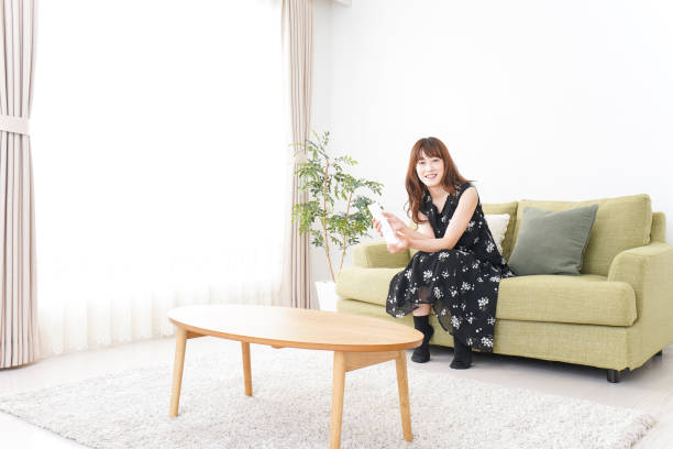 istock Woman watching TV at home 990347906