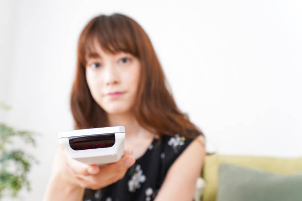 istock Woman watching TV at home 990350032