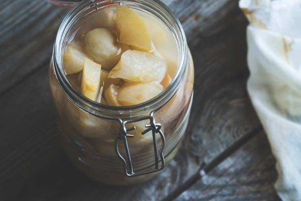 istock Apple cider vinegar in hinged lid jar on rustic background 990369142