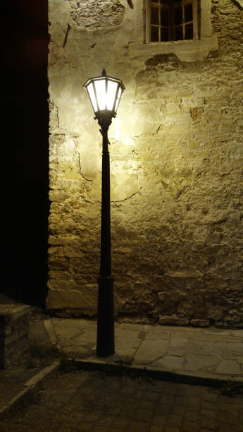 istock Lantern at night. Street Lantern lights off. Old Lantern at night. 990369990