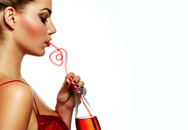 istock Girl with a drink. 990374774