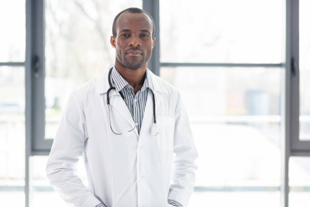 istock Serious medical worker looking at camera 990388856