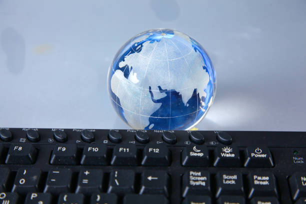 istock Cristal globe of the Earth on a Computer 990429060