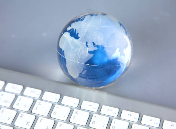 istock Cristal globe of the Earth on a Computer 990435664