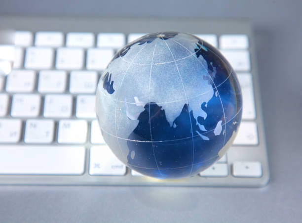 istock Cristal globe of the Earth on a Computer 990439288