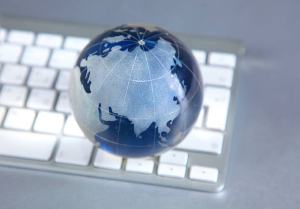 istock Cristal globe of the Earth on a Computer 990442020